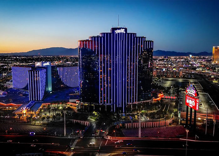 Nighttime view of the Rio hotel and casino in Las Vegas with city lights, related to Utah dance mom parent clash news.