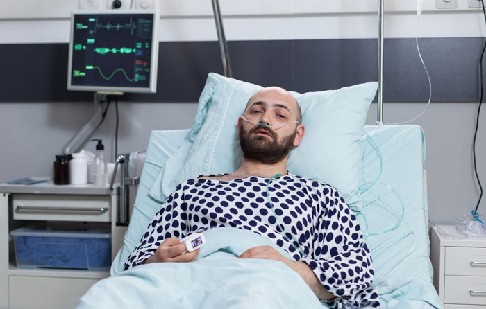 Man in hospital bed using oxygen and pulse oximeter, highlighting handicapped spot drama and entitled lady confrontation.