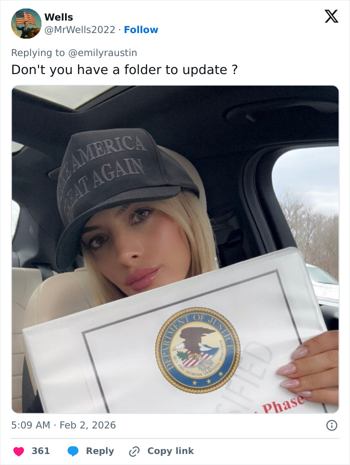 MAGA influencer Emily Austin wearing a Make America Great Again hat holding a document with Department of Justice seal.