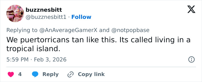 Tweet from user buzznesbitt discussing Puerto Rican tan and tropical island living in a casual social media reply.