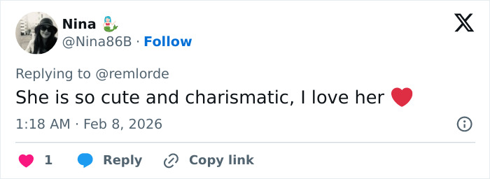 US figure skater holding broken gold medal in celebration, unable to keep it after it breaks during event.