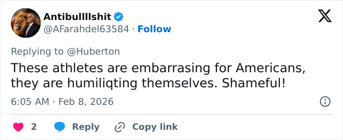 Screenshot of a social media reply showing backlash and threats related to Amber Glenn’s beliefs and public statements.