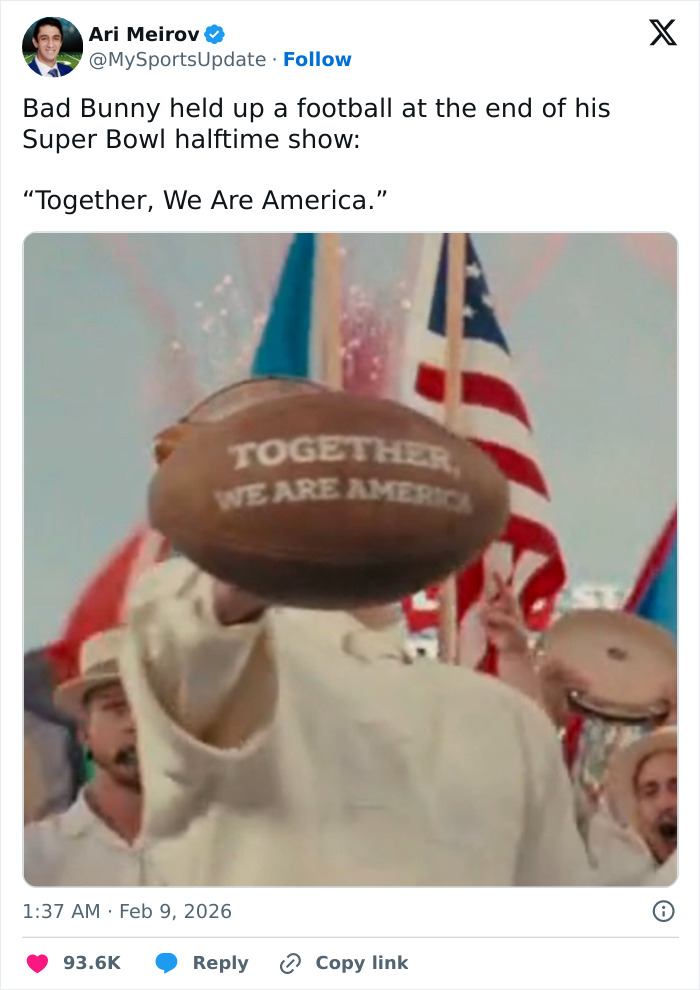 Bad Bunny holding a football with Together We Are America message during Super Bowl 2026 halftime show performance.