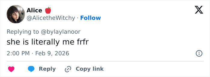 US figure skater holding broken gold medal during emotional celebration at an ice rink after competition victory.