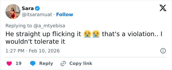 Tweet by user Sara reacting emotionally to a controversial low-cut dress advertisement causing online backlash.