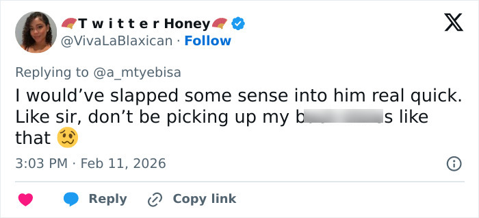 Twitter reply from user @VivaLaBlaxican expressing frustration about inappropriate behavior in a viral low-cut dress advertisement discussion.