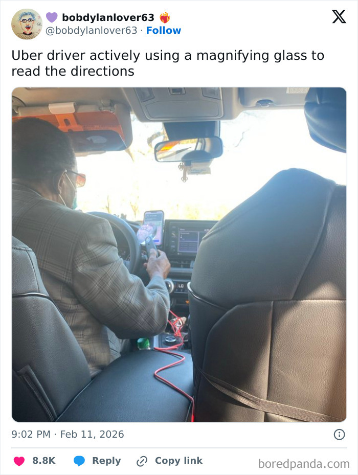Uber driver using a magnifying glass to read directions, capturing a chaotic and hilarious moment from February posts.
