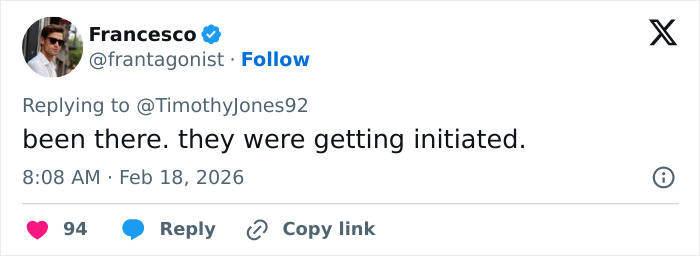 Tweet showing user Francesco replying about fraternity hazing initiation with a comment during a social media interaction.