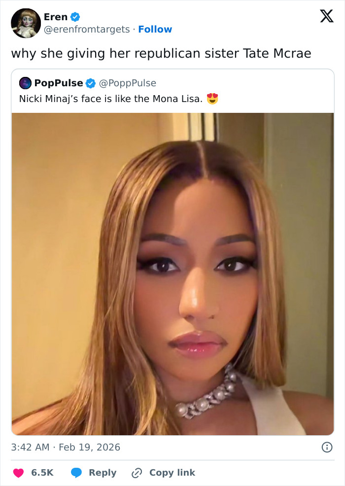 Nicki Minaj with a dramatic new look, straight highlighted hair, bold makeup, and a pearl necklace.