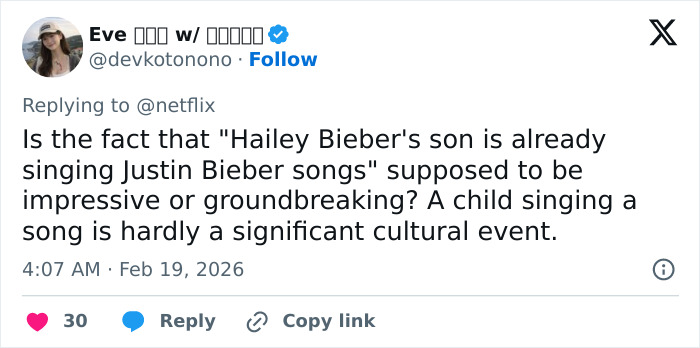 Tweet screenshot showing a user questioning Hailey Bieber&rsquo;s claim about her toddler son singing Justin Bieber songs, met with skepticism.