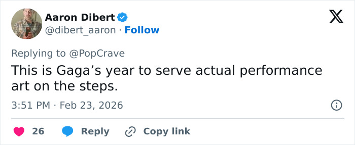 Tweet from Aaron Dibert replying to PopCrave about the Met Gala 2026 dress code sparking controversy and mixed reactions.