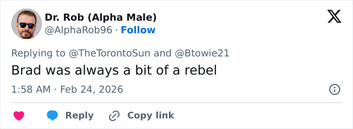 Zachery Ty Bryan from Home Improvement wearing sunglasses and a blue shirt, shown in a close-up outdoor photo.