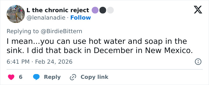 Screenshot of a Twitter reply discussing a hotel hack for washing underwear and sparking influencer backlash.