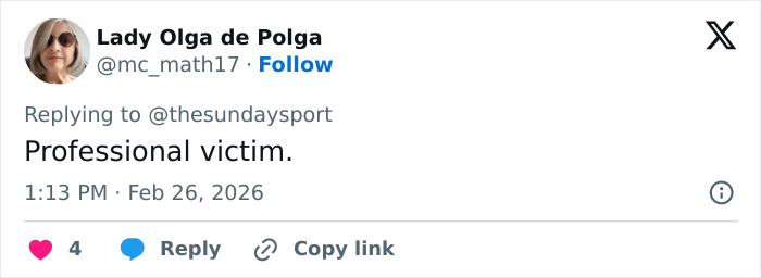 Tweet by user Lady Olga de Polga calling someone a professional victim, shown on a smartphone screen with timestamp and engagement icons.