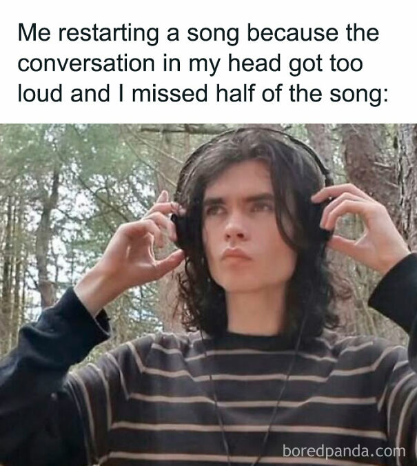Person outdoors in a striped shirt putting on headphones, relatable meme about restarting a song due to distracting thoughts.