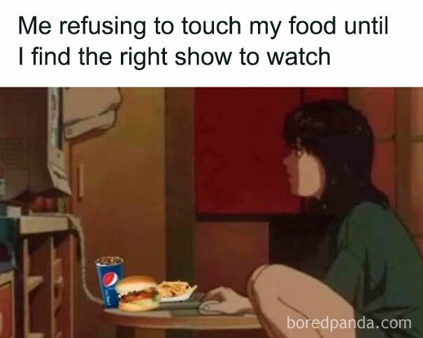 Person sitting on floor staring at TV with food on table, relatable meme about finding the right show to watch before eating.