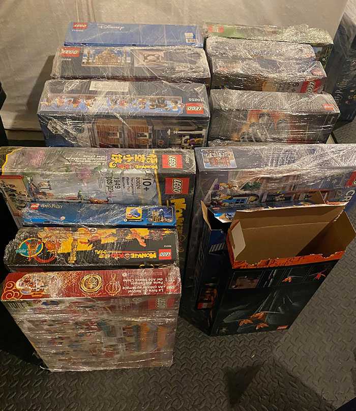 Several expensive Lego sets still in packaging wrapped in plastic, linked to cheating ex-wife's boyfriend theft case.