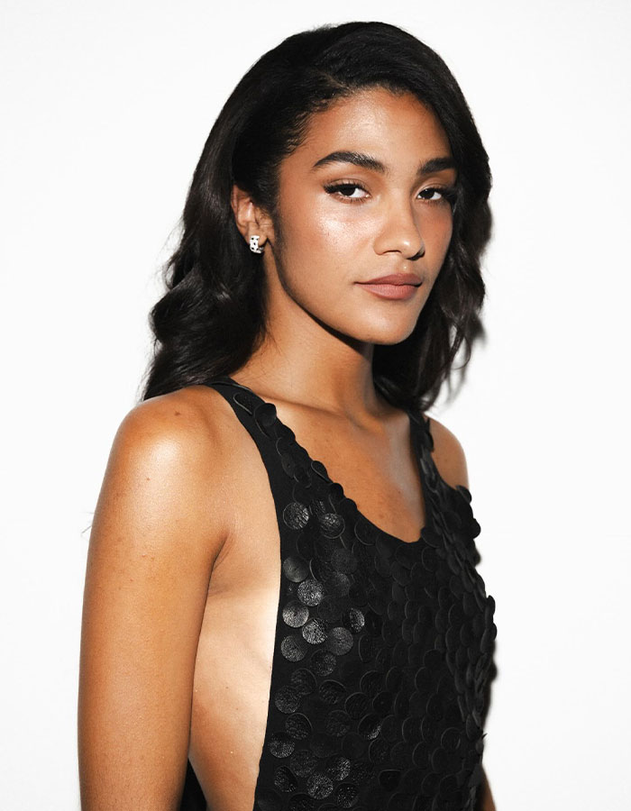 Olivia Dean posing in a black textured dress, highlighting her as the Best New Artist winner at the 2026 Grammys.