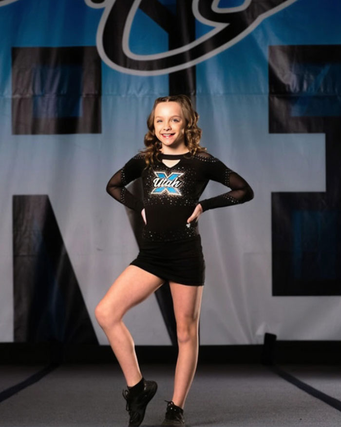 Young Utah dance mom performing on stage in black outfit, representing Utah Dance Mom&rsquo;s parent clash in Vegas tragedy context.