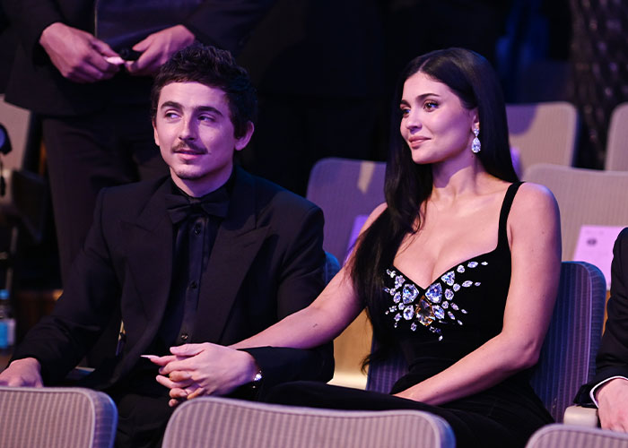 Kylie Jenner at the 2026 BAFTAs wearing a black embellished dress, fans noting major detail about her lip appearance.