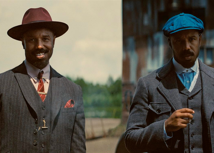 Two men dressed in vintage suits and hats, showcasing Michael B. Jordan's transformation for Sinners Twins role.