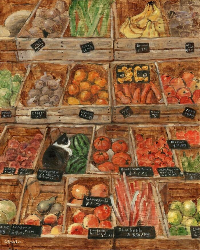 Painting of a cat sitting among various fruits and vegetables in wooden crates in cat-themed artwork.
