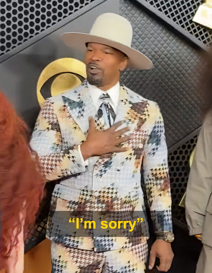 Jamie Foxx in patterned suit and hat on Grammy red carpet during a weird moment with Chappell Roan going viral.