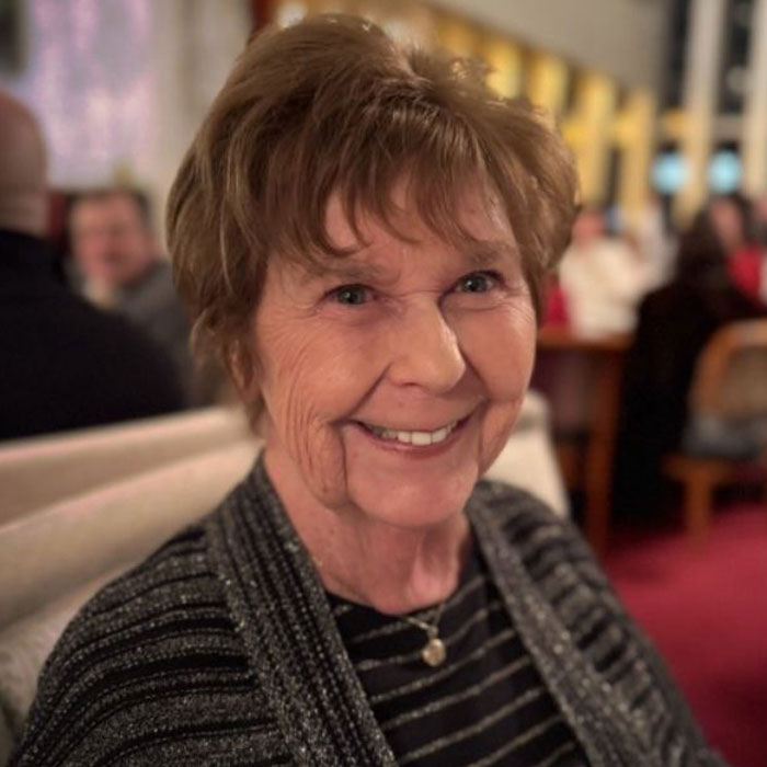 Elderly woman smiling indoors with a blurred background, related to police new theory after Arizona home disappearance.