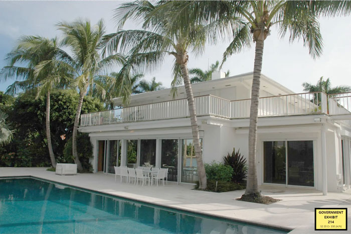 Modern white house with palm trees and a pool, related to exotic dancer's shocking allegations against Epstein and ex-Prince Andrew.