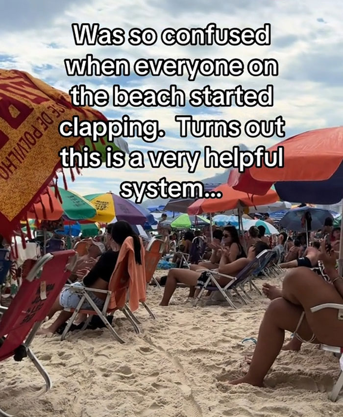 People sitting on beach chairs under umbrellas clapping, illustrating an effective way to deal with lost children.