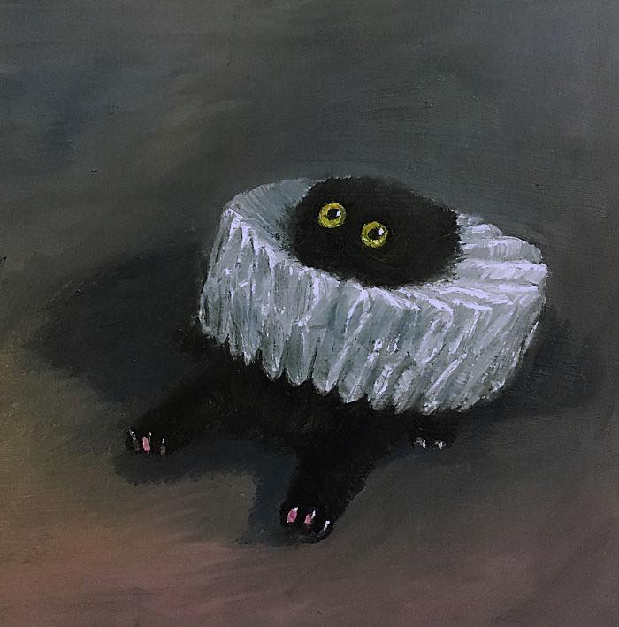 Black cat with yellow eyes and ruffled collar in a dark setting, featured in cat-themed artworks throughout history.