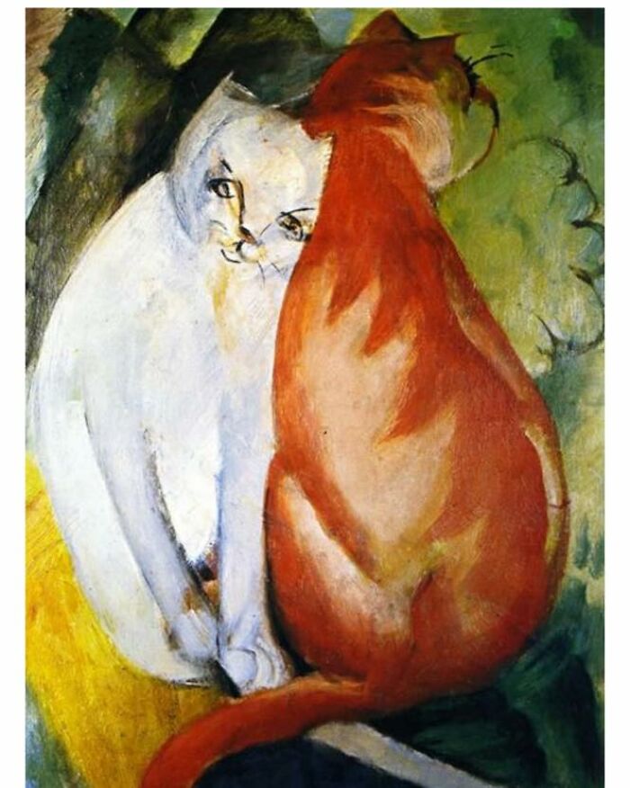 Two cats, one white and one orange, sitting closely together in a colorful cat-themed artwork.