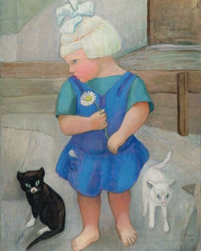 Child in blue dress holding a flower with black and white cats nearby in a cat-themed artwork throughout history.