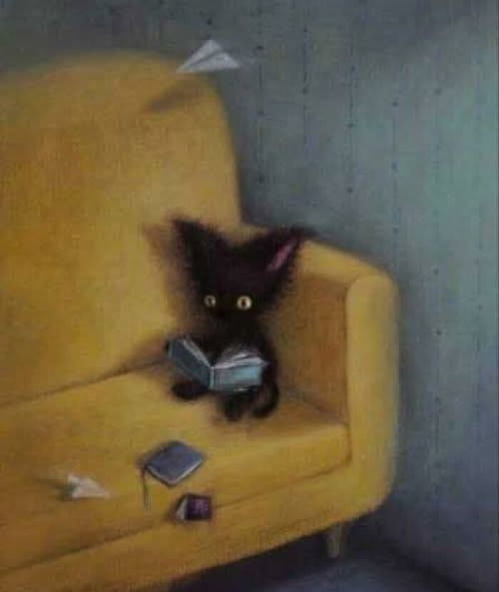 Black cat reading a book on a yellow couch in a dimly lit room, cat-themed artwork in a whimsical style.