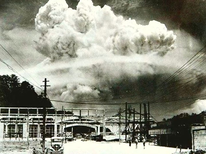 Black and white rare photo showing a massive explosion cloud over a town, capturing history between the headlines.