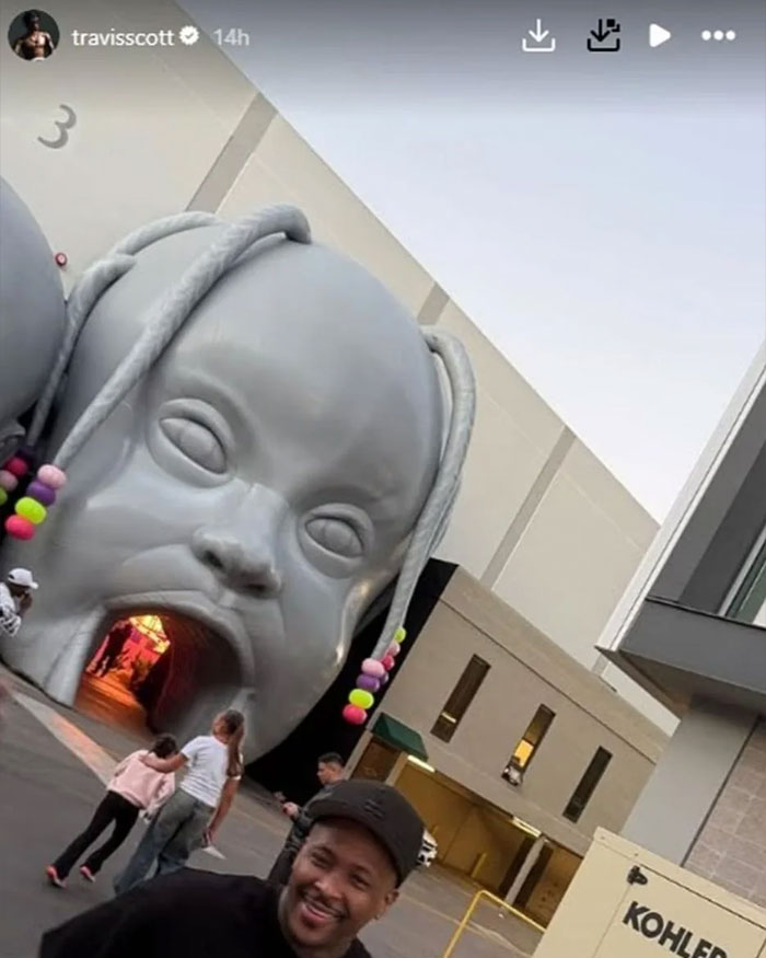 Giant gray baby face installation with colorful beads, part of Travis Scott and Kylie Jenner kids&rsquo; birthday party theme controversy.