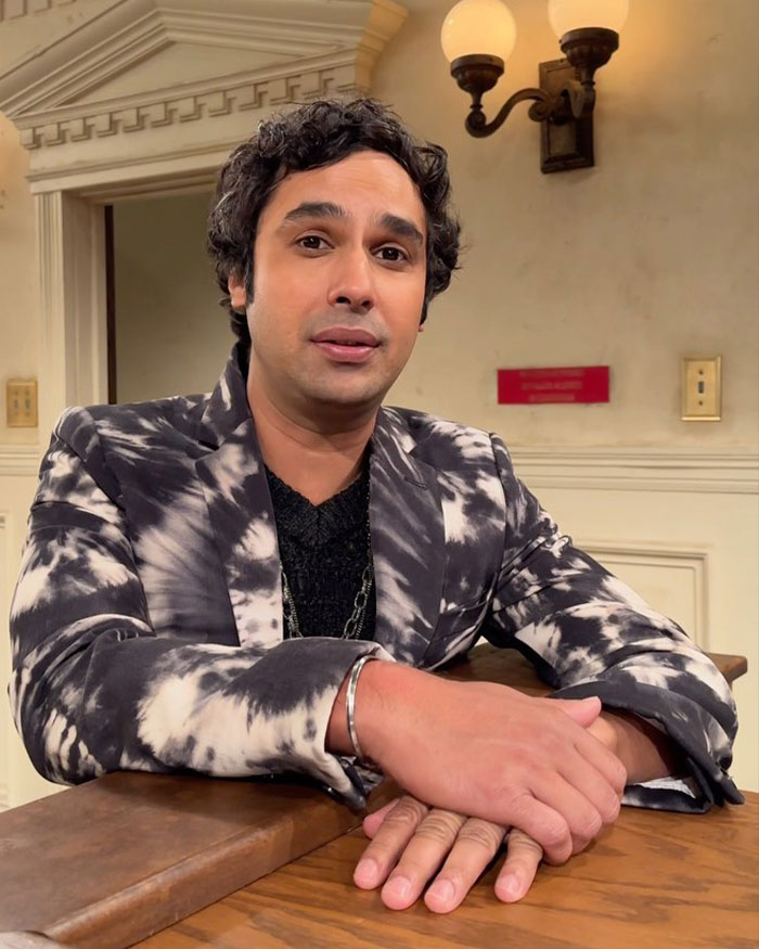 Kunal Nayyar from The Big Bang Theory seated indoors wearing patterned jacket, revealing GoFundMe with a shocked public response.