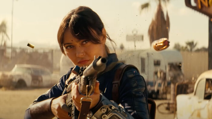 Woman aiming a s*****n in a post-apocalyptic setting, representing shows like Fallout for fans waiting for Season 3. - 6