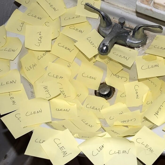 Sink filled with sticky notes all labeled clean, creating a weirdly hilarious image to improve your feed and mood.
