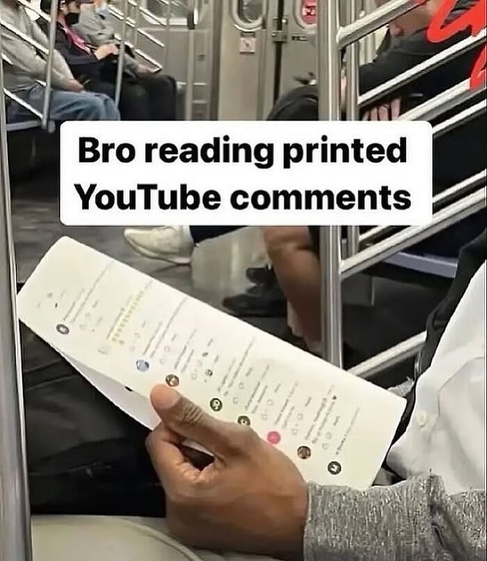 Man on subway reading printed YouTube comments, showcasing weirdly hilarious images to improve your feed and mood.