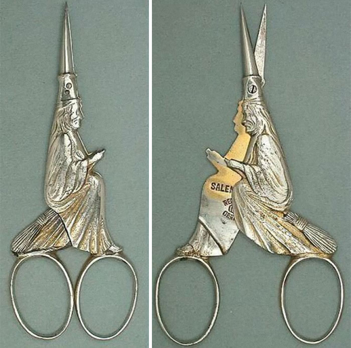 Pair of silver scissors shaped like witches sitting on broomsticks, displayed as a fascinating historical artifact in a museum of artifacts.