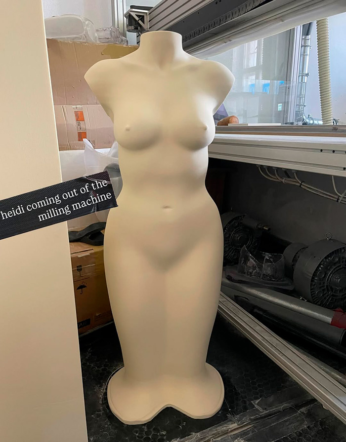 Mannequin torso shaped like a female body part displayed near industrial milling machine, related to Heidi Klum Grammys dress controversy.