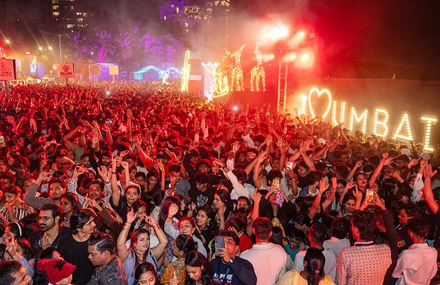 Crowd enjoying a vibrant night festival in Mumbai, one of the top cities in the world where sleep is optional.