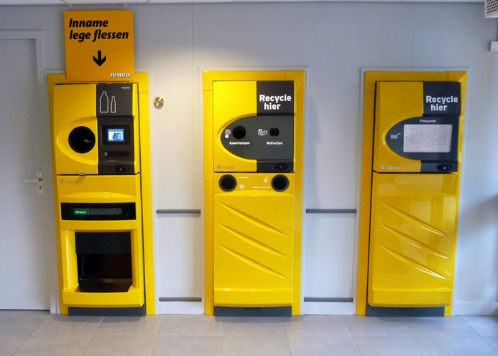 Yellow recycling machines for bottles and batteries in a country, showcasing things countries have that just make sense.