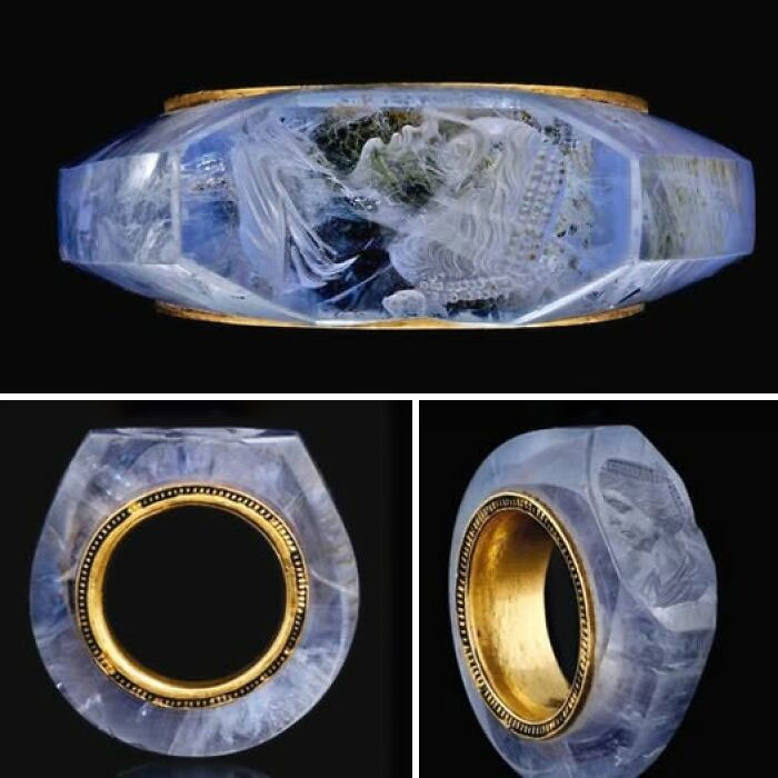Ancient carved gemstone ring with detailed figure engraving and gold interior, displayed from multiple angles in museum of artifacts.