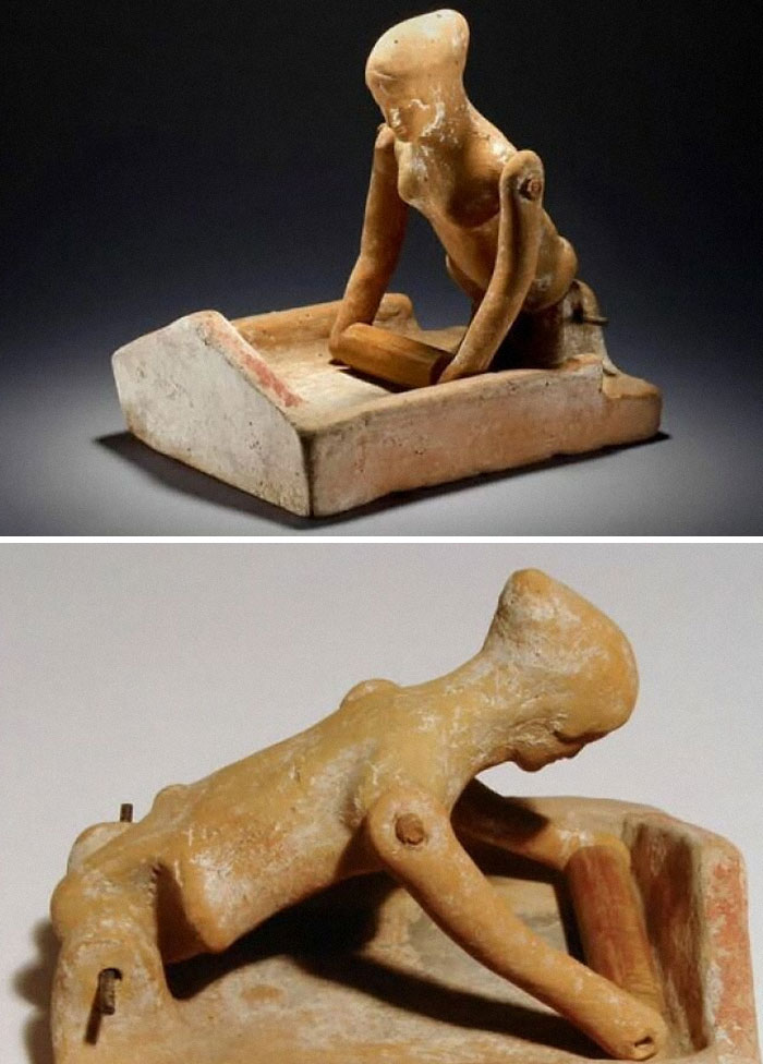 Ancient clay figurine of a person kneading dough displayed in a museum of artifacts collection.