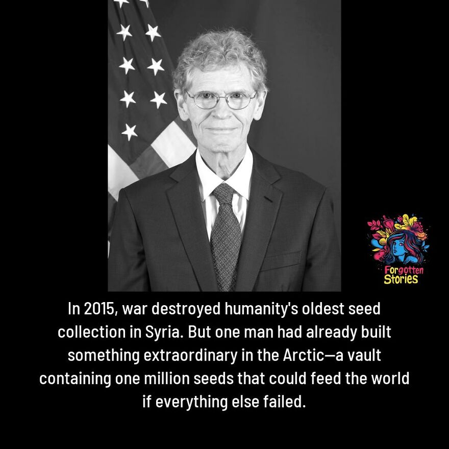 Man in suit with glasses near American flag, representing forgotten stories about war and Arctic seed vault preservation.