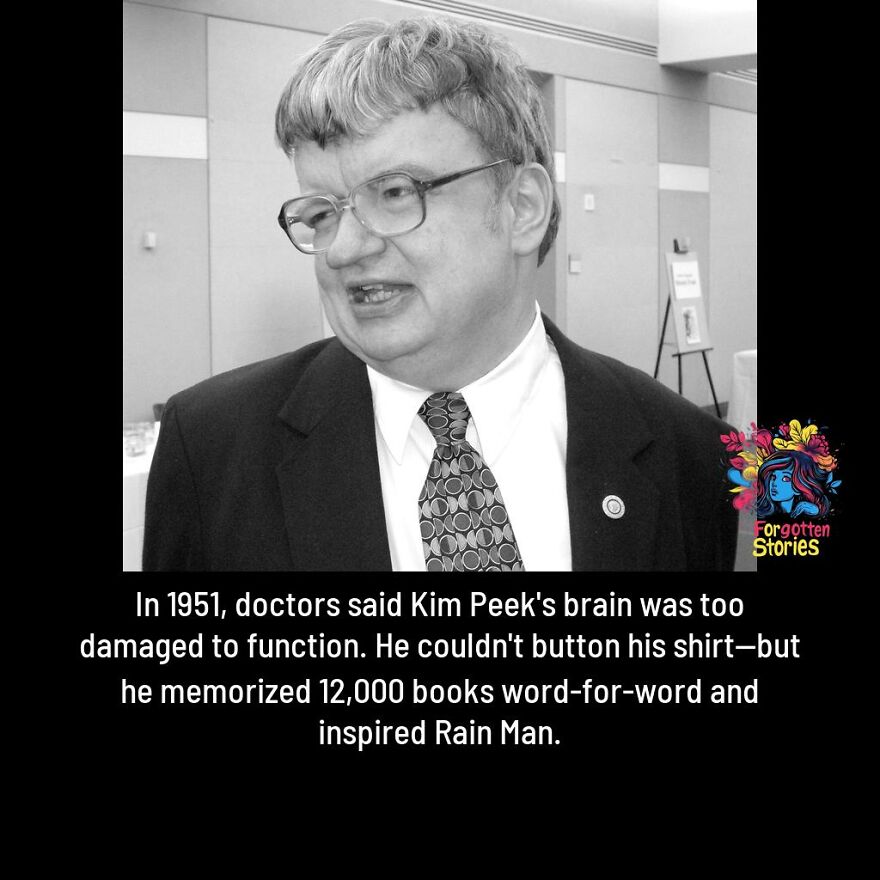 Black and white photo of a man with glasses in a suit sharing forgotten stories about Kim Peek's extraordinary memory.