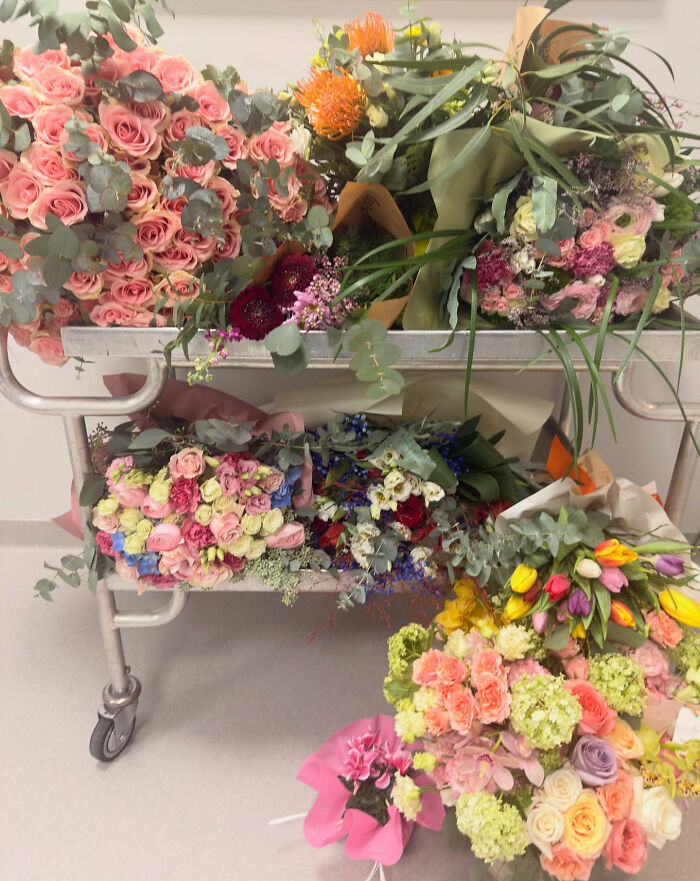 Bouquets of flowers on a cart, symbolizing support and recovery for Olympian Lindsey Vonn after her crash and leg injury.