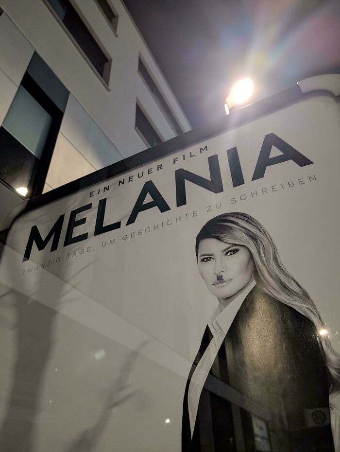 A chaotic good post featuring a Melania movie poster defaced with a Hitler mustache, inspiring you to be the hero.